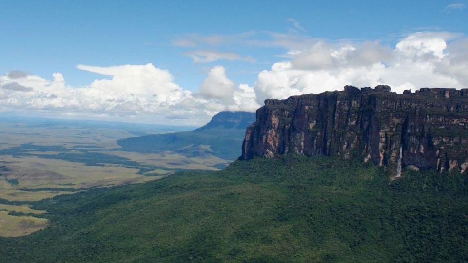 An aerial view of the grassy rocky landscape