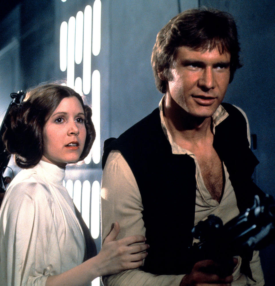 Carrie Fisher and Harrison ford in <em>Star Wars</em>. (Photo: Everett Collection)