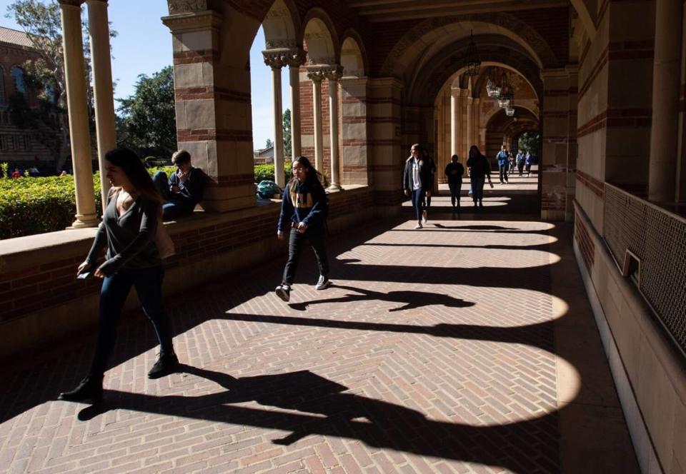 Students walk on the campus of UCLA at Royce Hall on Feb. 4, 2020, in Los Angeles.