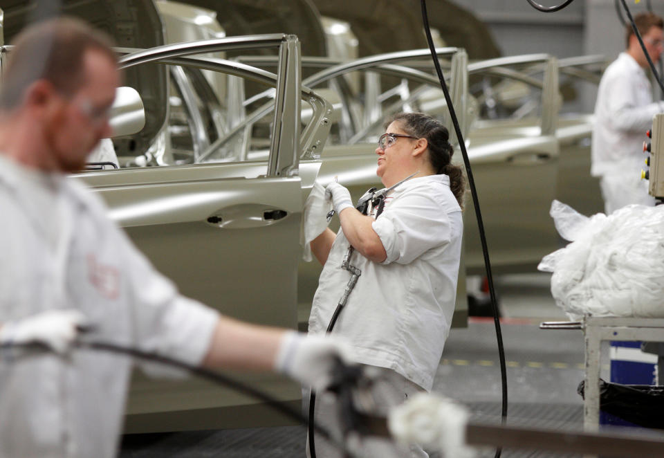 Michelle Arthur is seen working on the sealer line in the paint department during a tour of the Honda automobile plant in Marysville, Ohio October 11, 2012. REUTERS/Paul Vernon/File Photo GLOBAL BUSINESS WEEK AHEAD PACKAGE - SEARCH BUSINESS WEEK AHEAD SEPTEMBER 26 FOR ALL IMAGES