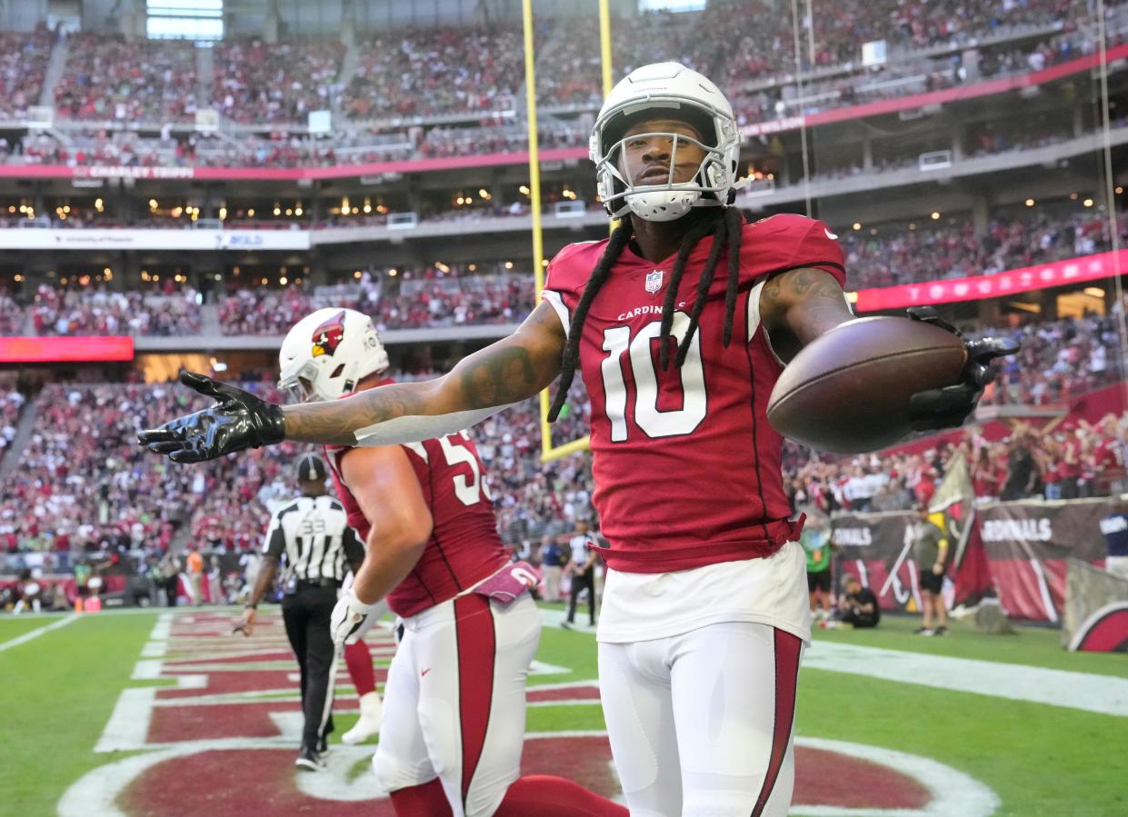 Nov 6, 2022; Phoenix, Ariz., United States;  Arizona Cardinals wide receiver DeAndre Hopkins (10) celebrates after a catch catch against the Seattle Seahawks during the first quarter at State Farm Stadium. Mandatory Credit: Michael Chow-Arizona Republic