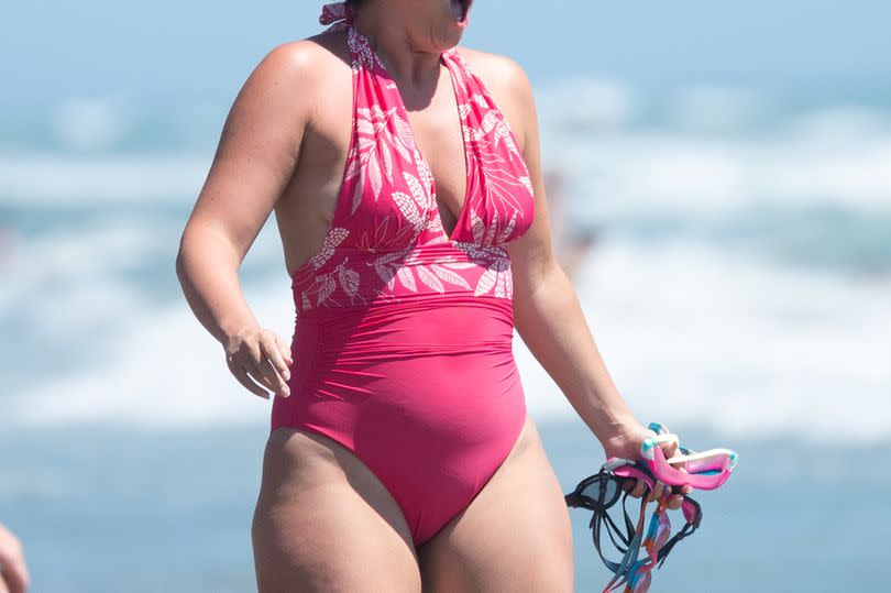 Jacqueline Jossa beach pink swimsuit