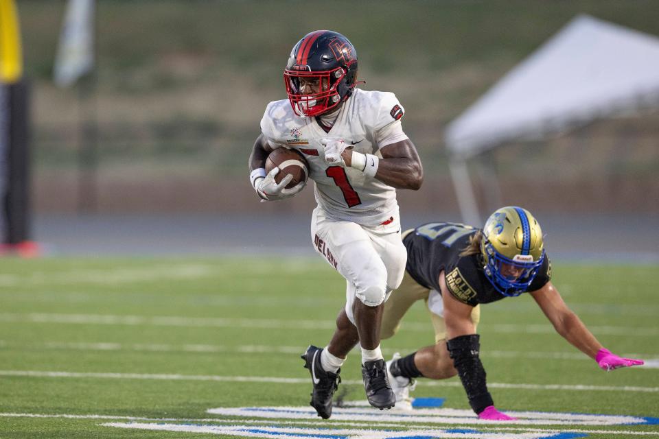 Del City's Rodney Fields (1) runs for a first down against Choctaw during a high school football game in Choctaw, Okla. on Friday, Aug. 25, 2023.