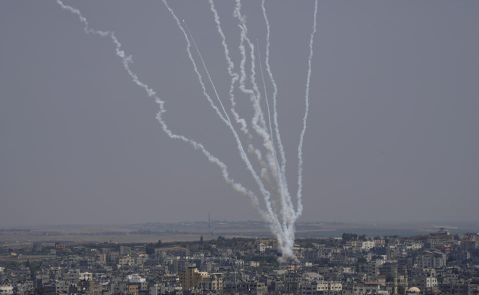 Rockets are launched from the Gaza Strip towards Israel, in Gaza City, Saturday, Aug. 6, 2022. (AP Photo/Hatem Moussa)