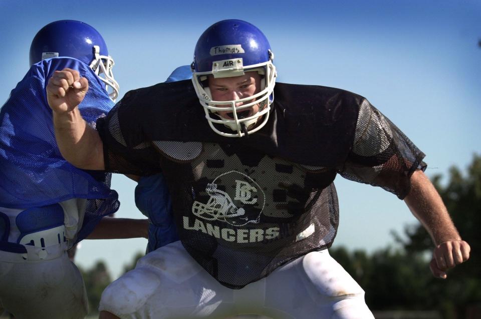 Joe Thomas goes through a defensive line drill during practice at Brookfield Central High School on Friday August 16, 2002.