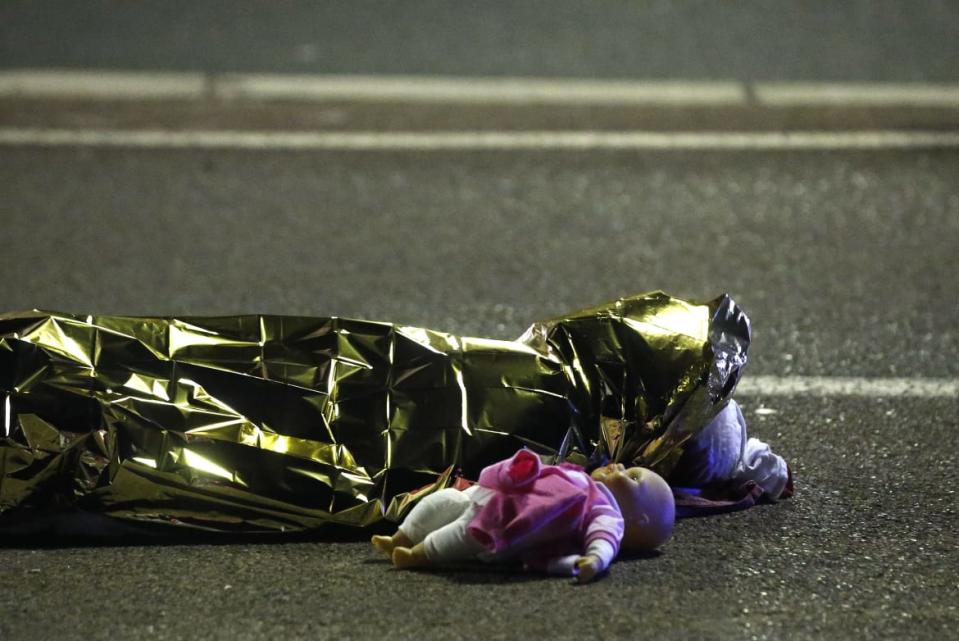 <div class="inline-image__caption"><p>A body is seen on the ground July 15, 2016 after at least 30 people were killed in Nice, France, when a truck ran into a crowd celebrating the Bastille Day national holiday July 14.</p></div> <div class="inline-image__credit">Eric Gaillard/Reuters</div>