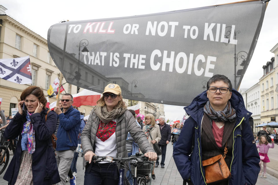 Anti-abortion demonstrators march in support of every conceived life and against steps taken by the new government to liberalize Poland's strict law and allow termination of pregnancy until the 12th week, in Warsaw, Poland, on Sunday, April 14, 2024. Last week, Poland's parliament, which is dominated by the liberal and pro-European Union ruling coalition, voted to approve further detailed work on four proposals to lift the near-ban on abortions. (AP Photo/Czarek Sokolowski)