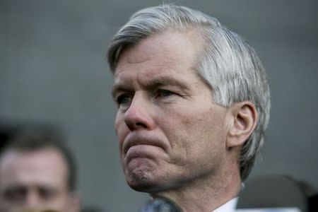 Former Virginia Governor Robert McDonnell pauses as she addresses the media after his sentencing hearing in Richmond, Virginia January 6, 2015. REUTERS/Jay Westcott