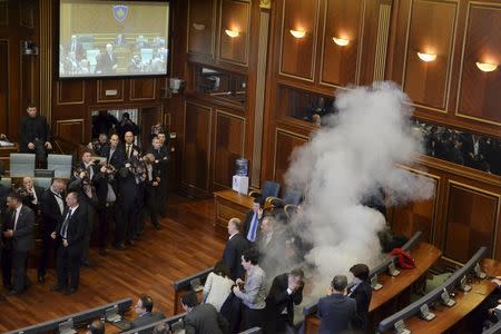 Opposition politicians release tear gas in parliament to obstruct a session in Pristina, Kosovo February 19, 2016. REUTERS/Agron Beqiri