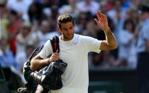 Argentina's Juan Martin Del Potro waves to the crowd after losing to Serbia's Novak Djokovic during day eleven of the Wimbledon Championships at The All England Lawn Tennis and Croquet Club, Wimbledon.