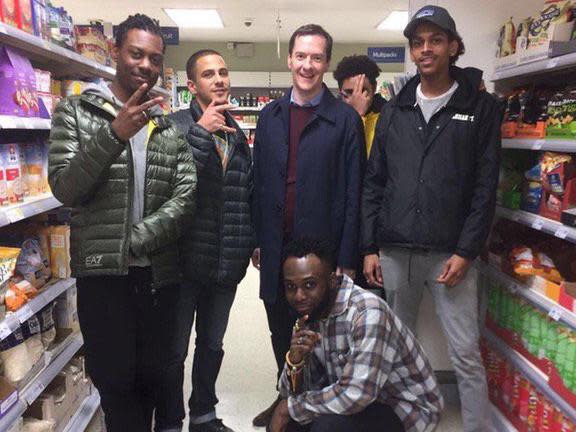 George Osborne poses with a group of youths in a supermarket: Twitter @BenGartside