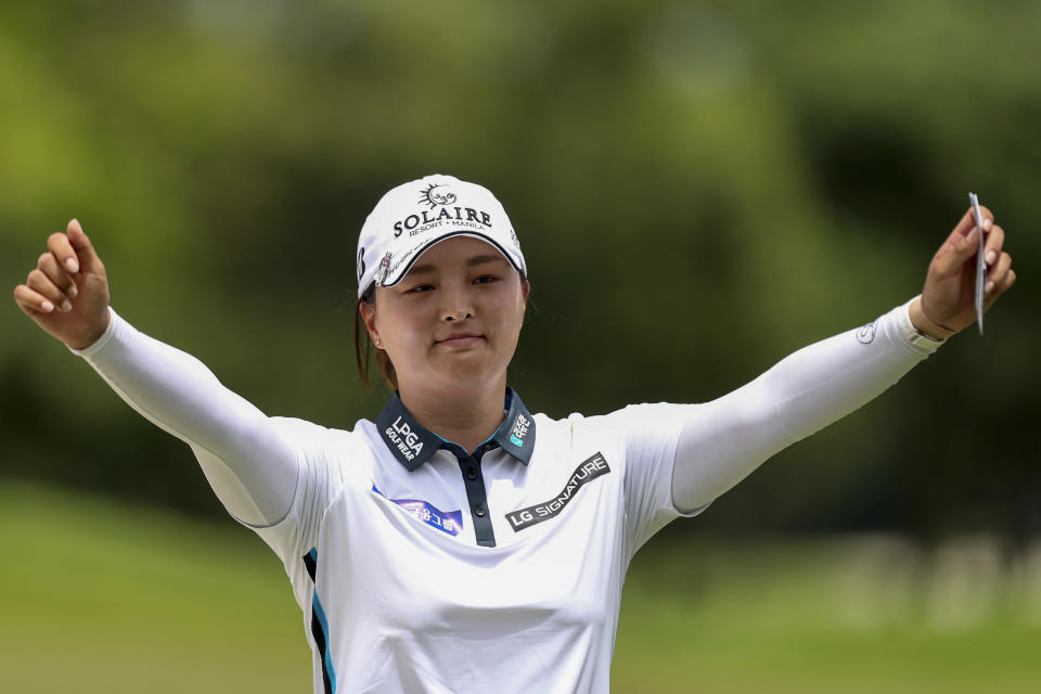 Jin Young Ko of South Korea celebrates winning the Women's World Championship of golf at Sentosa Golf Club in Singapore, Sunday, March 6, 2022. (AP Photo/Paul Miller)