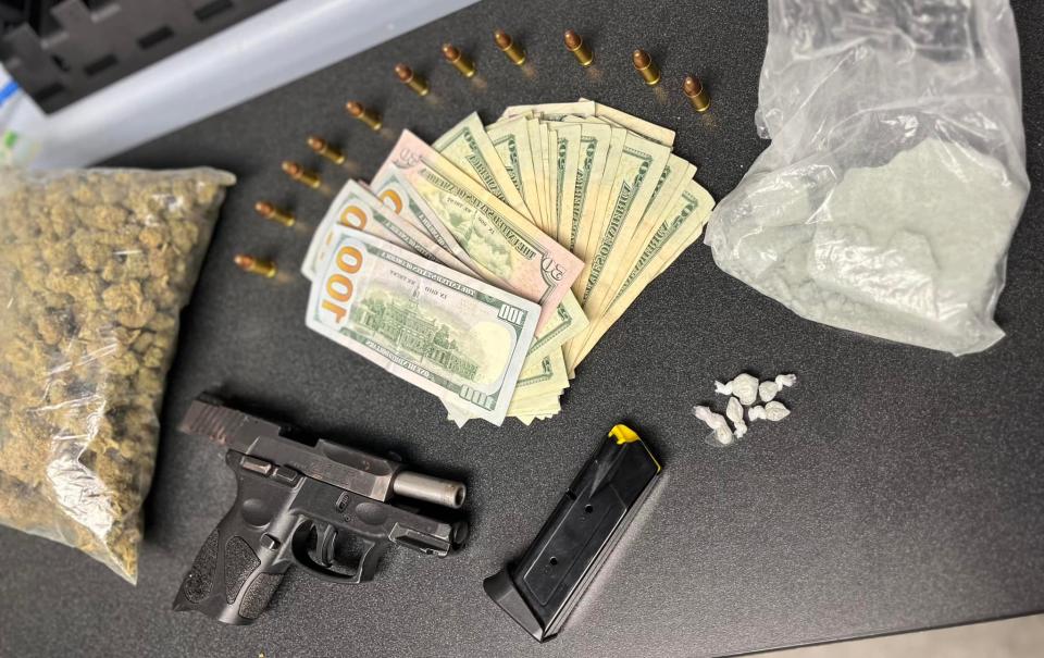 A handgun, along with cash and suspected cocaine and marijuana, Lansing police confiscated from a convicted felon in May who was charged with carrying a concealed weapon, felon in possession, felony firearm and other offenses after a traffic stop.