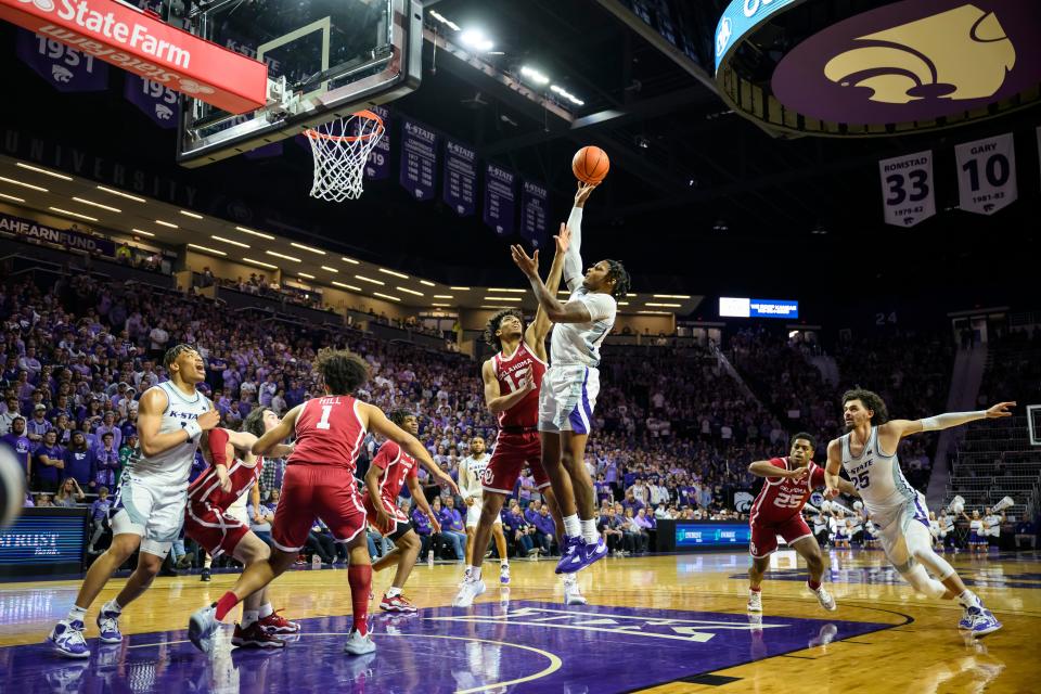 Kansas State guard Tykei Greene (4) goes up for a shot against Oklahoma during the second half of an NCAA college basketball game in Manhattan, Kan., Wednesday, March 1, 2023. (AP Photo/Reed Hoffmann)