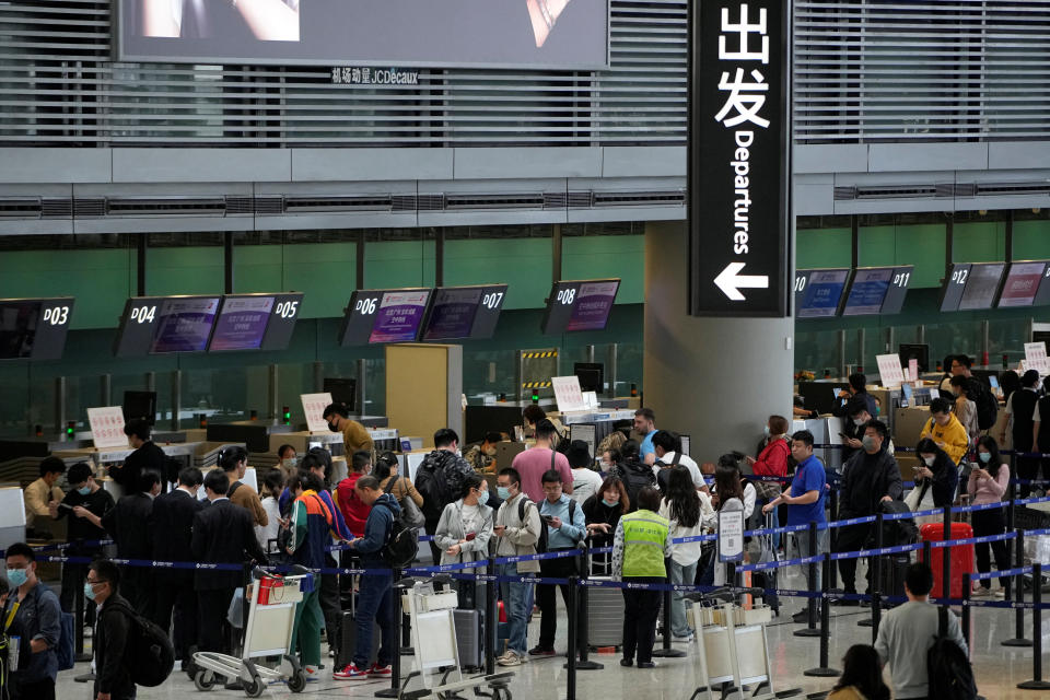 Travellers wait at check-in counters of Shanghai Hongqiao International Airport ahead of the five-day Labour Day holiday, in Shanghai, China, April 28, 2023. REUTERS/Aly Song