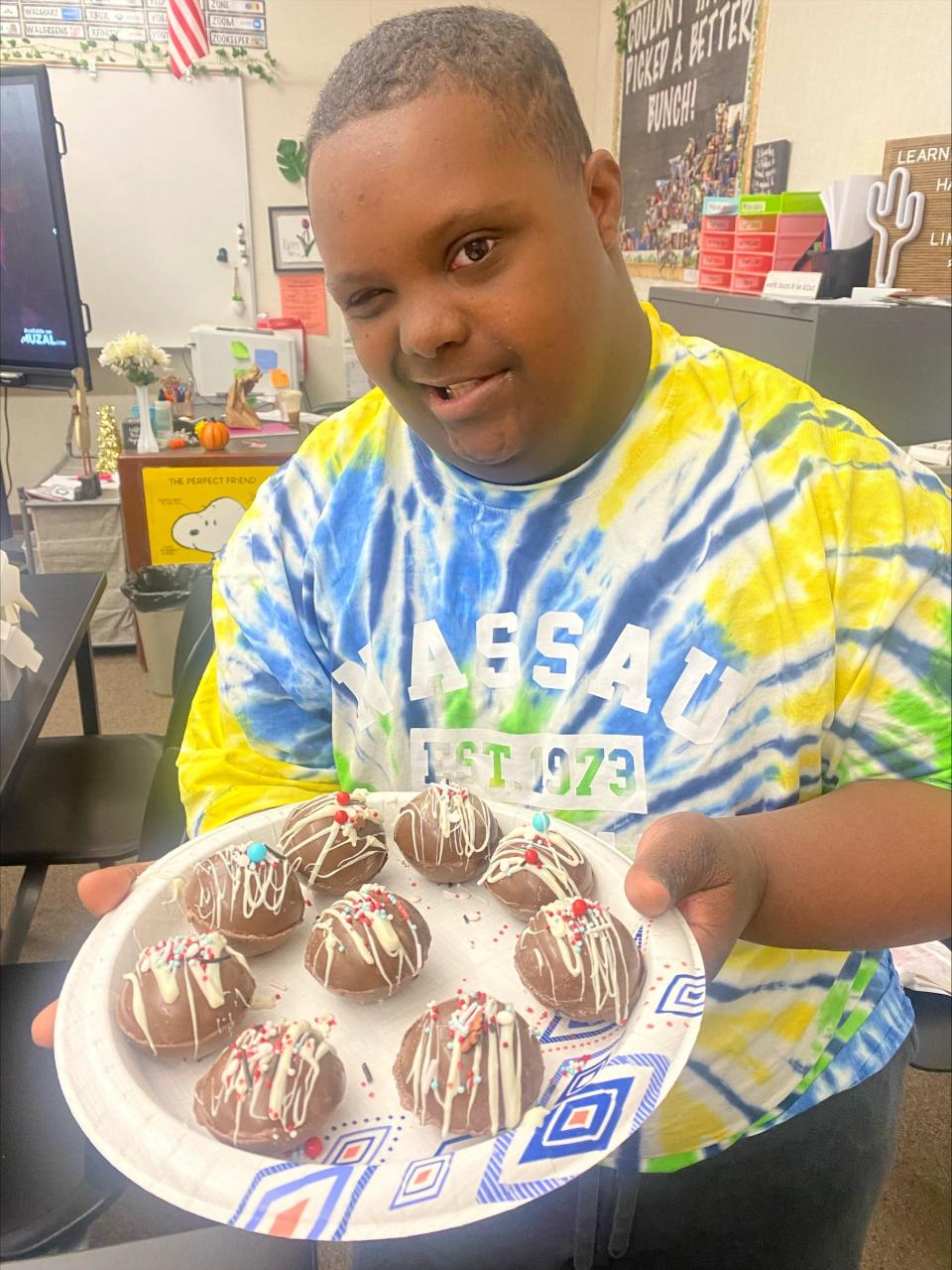 Kimball High School student Sin-Ai Alexander with some of this year's handmade cocoa bombs.