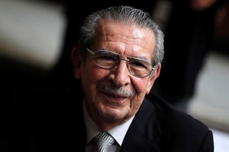 Former Guatemalan dictator Efrain Rios Montt smiles during his genocide trial, which is drawing to a conclusion, at the Supreme Court of Justice in Guatemala City, Guatemala May 8, 2013. REUTERS/Jorge Dan Lopez/Files