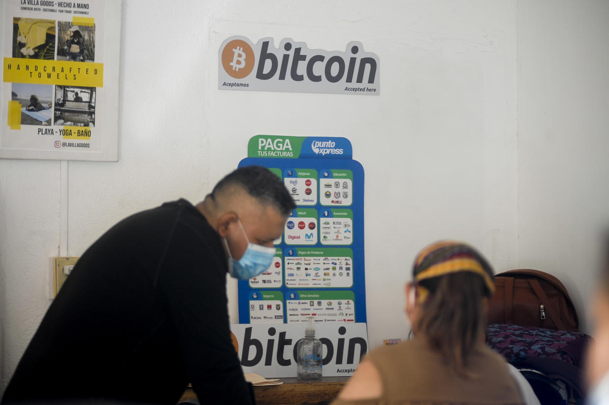 LA LIBERTAD, EL SALVADOR - JUNE 16: Salvadorans perform a bitcoin transaction on June 16, 2021 in Chiltuipan, El Salvador. Playa El Zonte has been named as the Bitcoins capital, around 500 families promote the use of the cryptocurrency to help the economy of a place with poverty issues. Salvadorans from the El Zonte community have been using Bitcoin for two years in their businesses, purchases, and basic basket payments. El Salvador became the first country in the world in recognizing bitcoin as legal tender. (Photo by Alex Pena/Anadolu Agency via Getty Images)