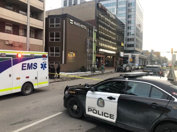 Calgary police and EMS remained on the scene near the Nuvo Hotel in the Beltline around 5 p.m. Wednesday after a shooting. (Meghan Grant/CBC - image credit)