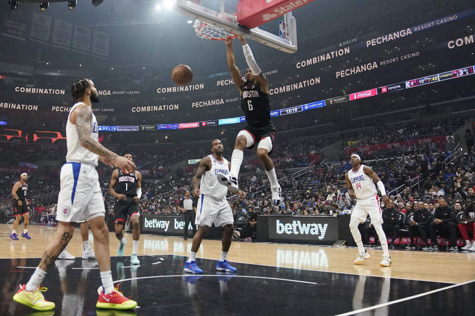 Houston Rockets forward Kenyon Martin Jr. (6) dunks against the Los Angeles Clippers during the first half of an NBA basketball game, Sunday, Jan. 15, 2023, in Los Angeles. (AP Photo/Marcio Jose Sanchez)