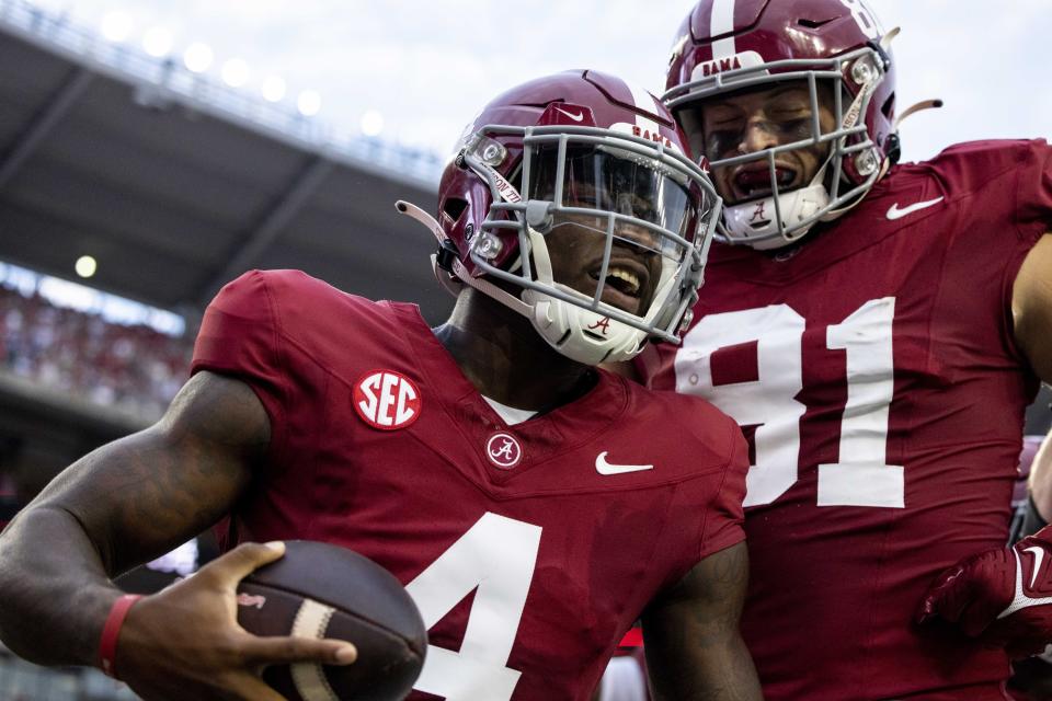 Alabama quarterback Jalen Milroe (4) celebrates his touchdown run against Middle Tennessee with tight end CJ Dippre (81) during the first half an NCAA college football game Saturday, Sept. 2, 2023, in Tuscaloosa, Ala. (AP Photo/Vasha Hunt)