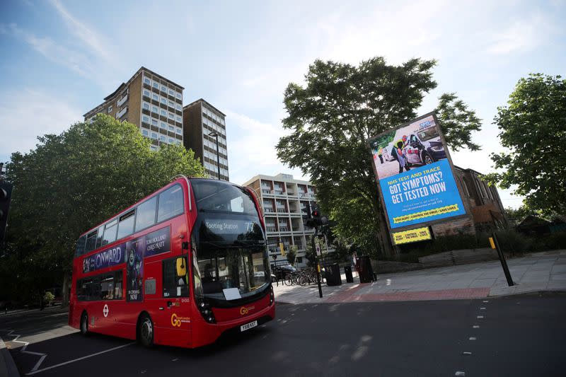 FILE PHOTO: A government and NHS Test and Trace advert is seen on a billboard in London