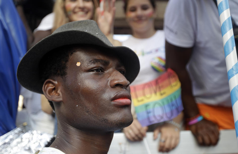 A reveler takes part in the gay pride parade in Milan, Italy, Saturday, June 29, 2019. (AP Photo/Luca Bruno)
