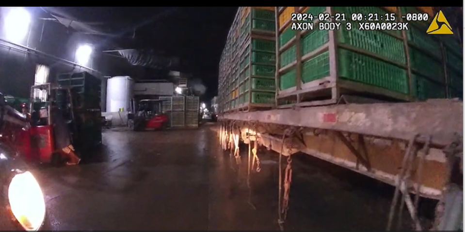 Sanger Police Department body camera footage shows the area where 19-year-old Jose Abrego died in a workplace fatality at Pitman Family Farms on Feb. 21, 2024. A police report said the area where the truck and trailers were driving throgh was “incredibly narrow” and “dark with zero lighting.”