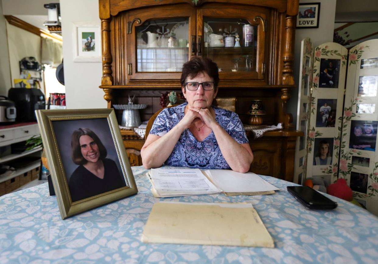 Vicky Cupp, 67, of Tecumseh, Mich. sits at her dining room table going over all the documents she has collected over the years related to the murder of her daughter Kyle Smith, who was shot outside of a nightclub on Woodward avenue the night before Super Bowl XL in Detroit. Cupp says the police told her family that it was a “delayed arrest” situation, but 18 years later the family still does not know what happened to Kyle, who was 24 at the time of her death.