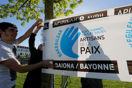 Youths prepare a banner on the eve of a demonstration to mark the handover of arms and explosives by civilian middlemen collected from the Basque militant separatist group ETA, in Bayonne, France, April 7, 2017. Banner reads, "Artisans of Peace". REUTERS/Regis Duvignau