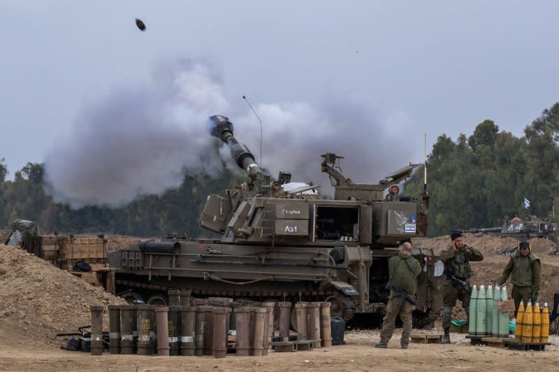 Israeli soldiers fire a 155mm self-propelled Howitzer shell from a base in southern Israel into the Gaza Strip on Tuesday. Photo by Jim Hollander/UPI
