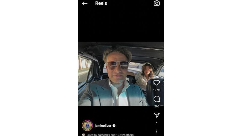 couple taking selfie in vintage car