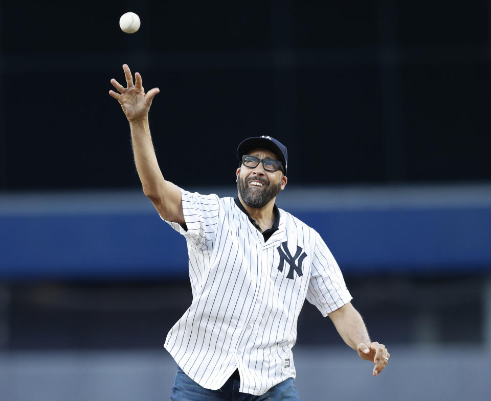 David Fizdale throws out the ceremonial first pitch at Yankee Stadium on Tuesday night. (AP)