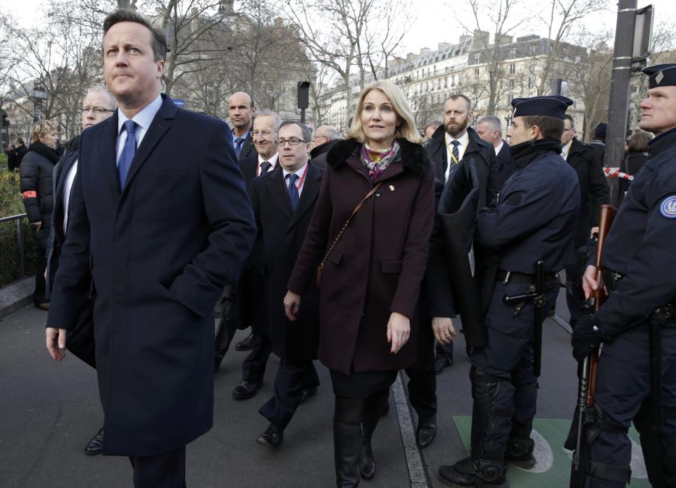 Britain's Prime Minister David Cameron and Denmark's Prime Minister Helle Thorning Schmidt arrive with heads of state to attend the solidarity march (Marche Republicaine) in the streets of Paris January 11, 2015. French citizens will be joined by dozens of foreign leaders, among them Arab and Muslim representatives, in a march on Sunday in an unprecedented tribute to this week's victims following the shootings by gunmen at the offices of the satirical weekly newspaper Charlie Hebdo, the killing of a police woman in Montrouge, and the hostage taking at a kosher supermarket at the Porte de Vincennes. REUTERS/Philippe Wojazer (FRANCE - Tags: CRIME LAW POLITICS CIVIL UNREST SOCIETY)