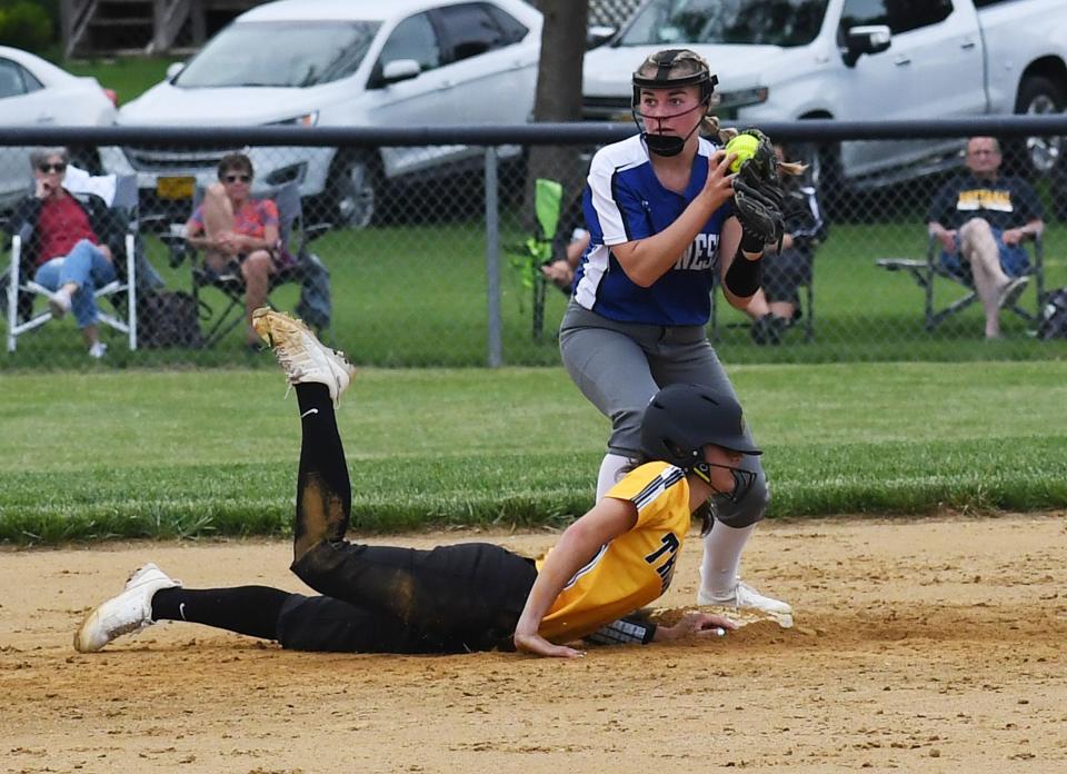 Colo-NESCO shotrstop Izabell Voelker catches the ball to force out West Marshall's Lauren Solberg (5) on a double play during the fourth inning of the Royals' 4-0 loss to the Trojans at Stan Vigness Field Tuesday, June 7, 2022, in McCallsburg, Iowa.