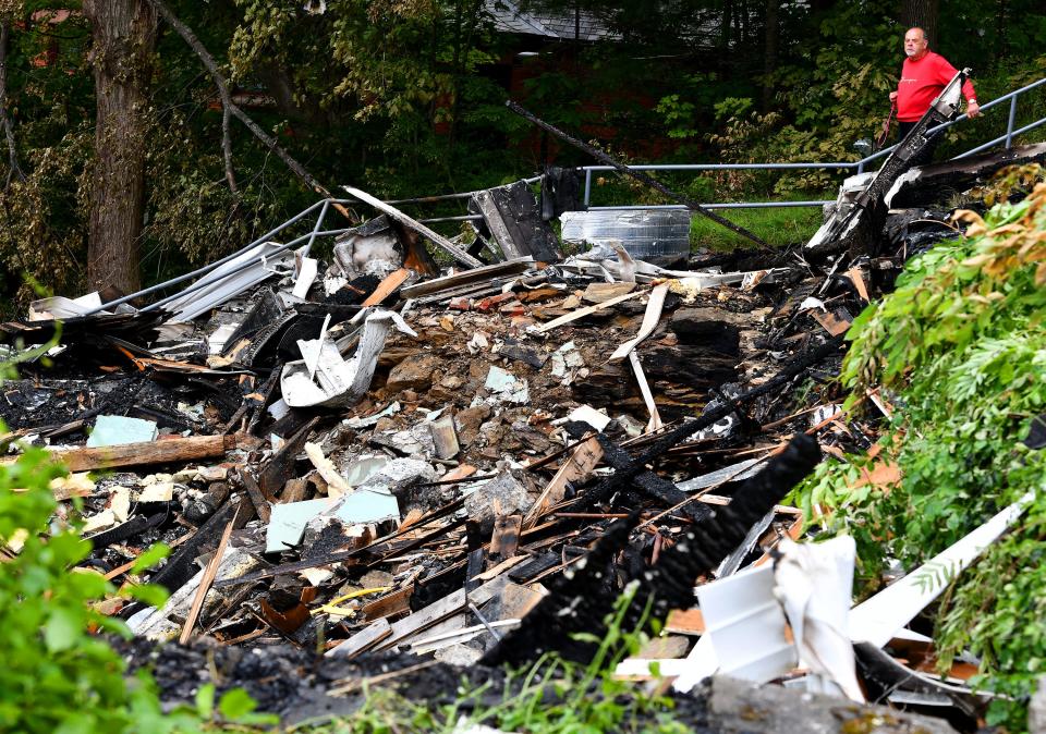 Mike Shocik of Charlton, who lived in Spencer in the '80s, made a special visit Monday to view all that remains of the First Congregational Church.