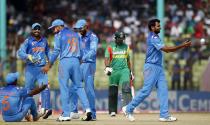 Bangladesh's Shamsur Rahman (2nd R) leaves the field as India's fielders celebrate his dismissal during their Asia Cup 2014 one-day international (ODI) cricket match in Fatullah February 26, 2014.