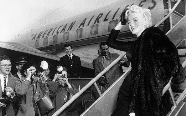 Braving it in heels: flat shoes were not an option for Marilyn Monroe, pictured in 1959 at LaGuardia Airport, New York, before flying off to Chicago for the premiere of Some Like It Hot - Bettmann
