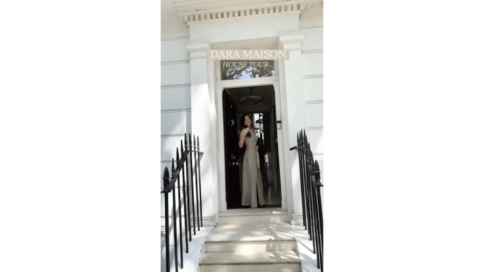 Dara Huang outside her white brick townhouse