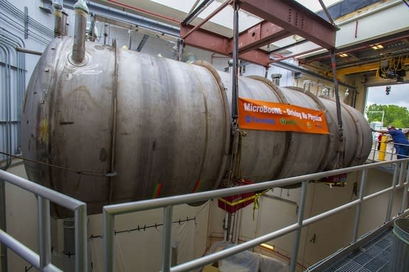 The detector for the MicroBooNe is gently lowered into place.