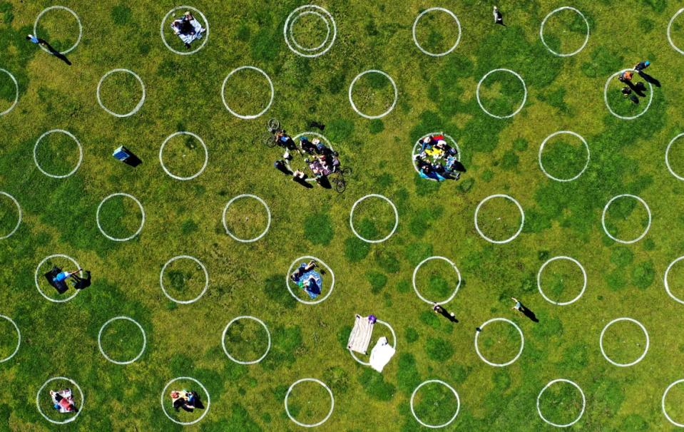 <div class="inline-image__caption"><p>New social distancing circles were shown at Dolores Park on May 20, 2020 in San Francisco, California. The move followed similar efforts by other parks in cities around the world in an effort to get back to some semblance of normalcy over the summer.</p></div> <div class="inline-image__credit">Justin Sullivan/Getty</div>