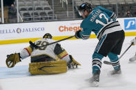 Vegas Golden Knights goaltender Marc-Andre Fleury, left, defends against a shot by San Jose Sharks center Patrick Marleau (12) during the first period of an NHL hockey game in San Jose, Calif., Wednesday, May 12, 2021. (AP Photo/Jeff Chiu)