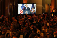 Guests listen as U.S. President Donald Trump delivers remarks at the National Republican Congressional Committee March Dinner in Washington, U.S., March 21, 2017. REUTERS/Carlos Barria