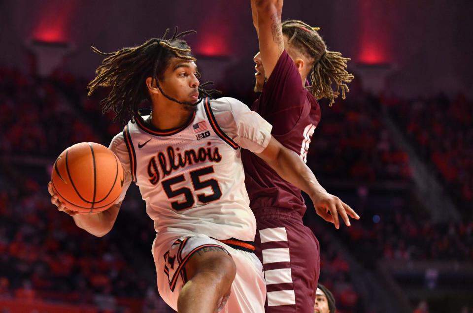 Illinois Fighting Illini guard Skyy Clark (55) drives the ball against Alabama A&M Bulldogs guard Dailin Smith (15) on Dec 17, 2022 during the first half at State Farm Center.