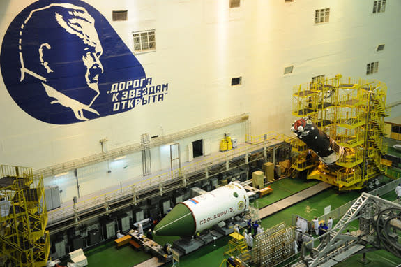 Russia's unmanned Progress 59 cargo ship prepared to be loaded inside its protective fairing ahead of its April 28, 2015 launch atop a Soyuz rocket.