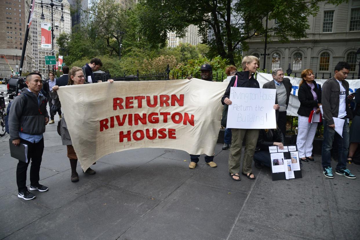 Demonstrators outside City Hall protest the lifting of a deed restriction on Rivington House before a City Council hearing in Manhattan, New York on Thursday, September 29, 2016. 