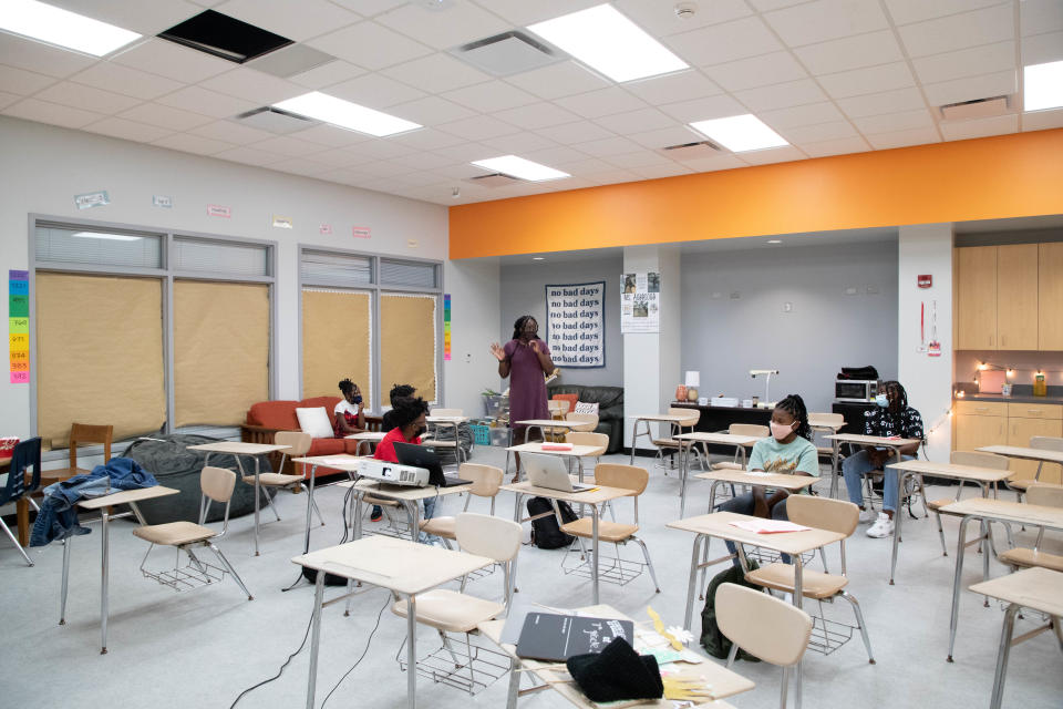 Language arts teacher Allison Agbasoga goes through introductions with students as they arrive to her classroom on the first day of school at Griffin Middle School Wednesday, August 11, 2021.