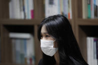 Han Shin Bi, a high school senior in Seoul, wearing a face mask speaks during an interview in Seoul, South Korea, on Sept. 18, 2020. “Online classes were really inconvenient,” said Han. Experts say the reduced interaction with teachers, digital distractions and technical difficulties are widening the education achievement gap among students in South Korea, leaving those less well off, like Han, at even more at a disadvantage. (AP Photo/Lee Jin-man)