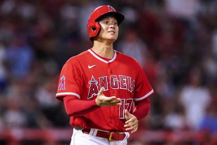 Shohei Ohtani asks for his gloves during the 10th inning of the Angels' comeback win.