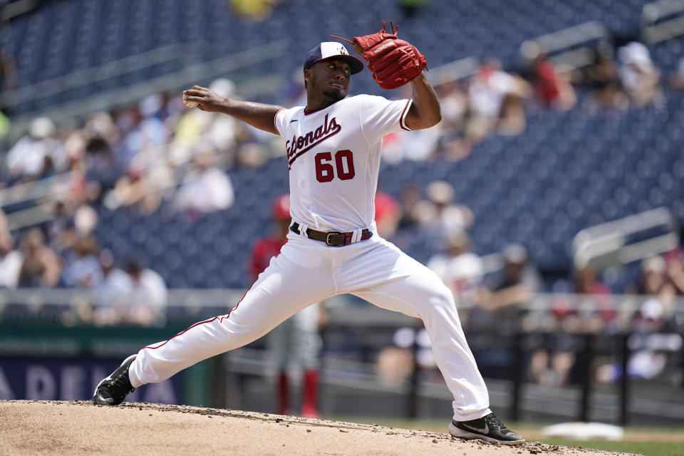 Washington Nationals starting pitcher Joan Adon throws to the Philadelphia Phillies in the second inning of the first game of a baseball doubleheader, Friday, June 17, 2022, in Washington. (AP Photo/Patrick Semansky)